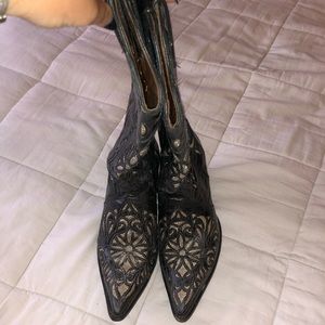 Woman’s black and gold cowboy boots